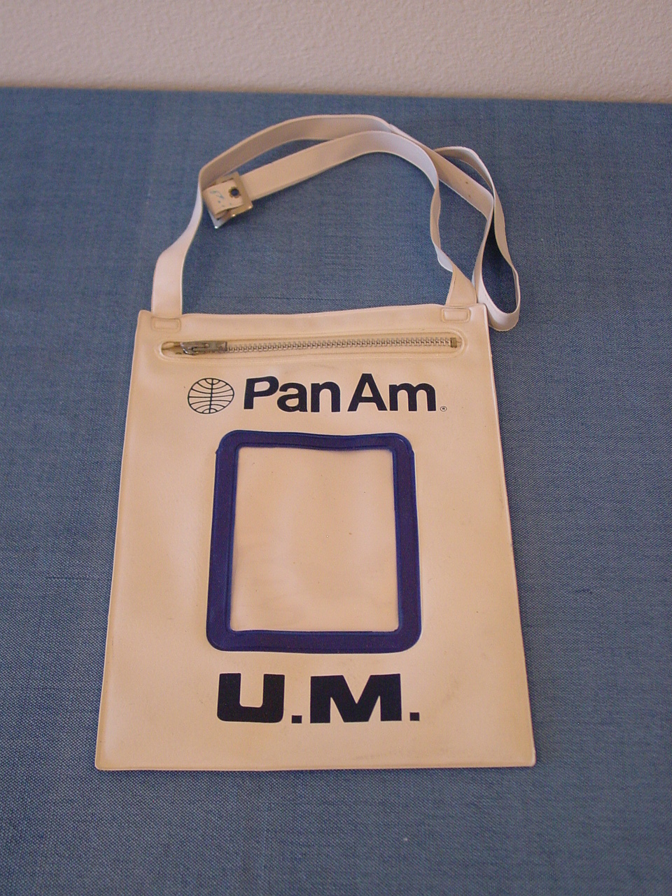 For young unaccompanied minors Pan Am had a pouch for them to wear so they could be easily identified by flight and ground crew.  This sameple in the Helvetica style dates from the early 1970s.